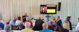 Howard Cockburn presenting a musical quiz at the Callers Get-together